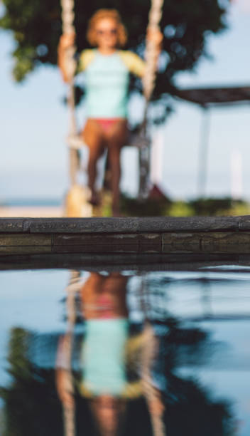 istock Blurred Motion Of Woman With Reflection In Water 1278941879