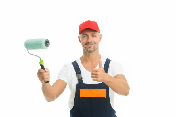 istock Refresh walls by yourself easily. Decorator hold paint roller. Wall painter. Paint work. Paint shop. Renovation and repair. Renewal and redecorating. Professional equipment. Mature man in cap 1278943782
