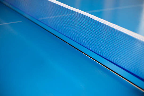 istock Net of table tennis ping pong on blue background. 1278943921