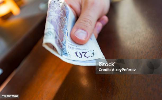 Man Paying By 20 Pound Notes At Cafe Or Shop In London Stock Photo - Download Image Now