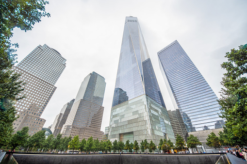 Aerial view of National September 11 Memorial & Museum surrounded by city, Lower Manhattan, New York City, New York State, USA.