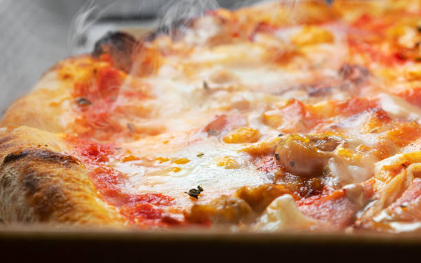 istock Freshly prepared pizza in a cardboard box. 1278951169