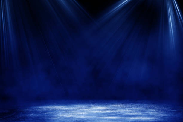 istock Studio dark room concrete floor grunge texture background with blue lighting effect for product showing. 1278951643