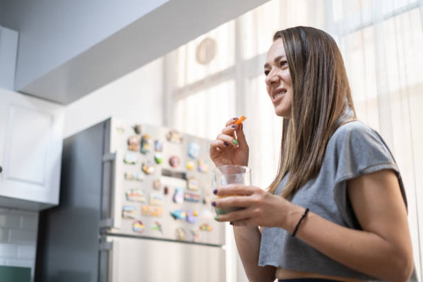istock Disgusted woman drinking healthy detox in kitchen 1278951768