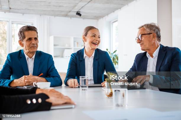 Happy Senior Business People During Meeting Stock Photo - Download Image Now - Corporate Governance, 65-69 Years, 70-79 Years