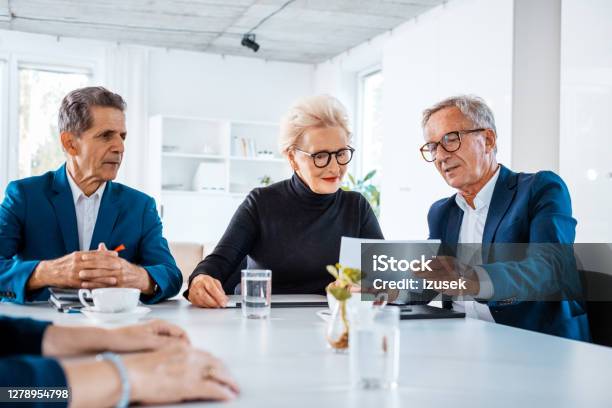 Senior Business People During Meeting Stock Photo - Download Image Now - 65-69 Years, 70-79 Years, Active Seniors