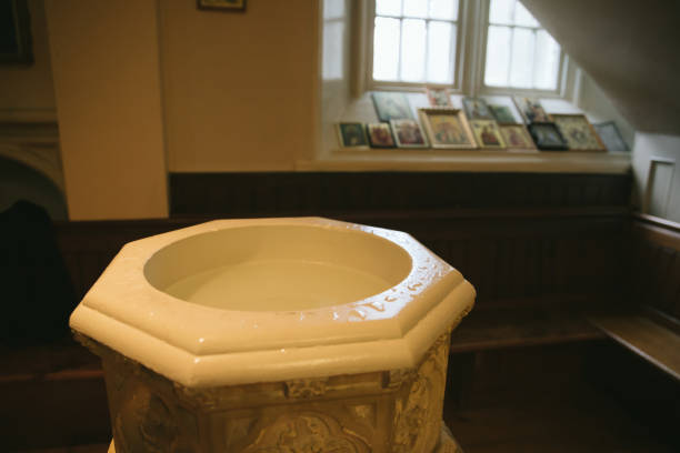 baptismal font in a church with a window
