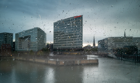 Rainy day in Hamburg, Germany. View out of a train window while arriving at the main station.