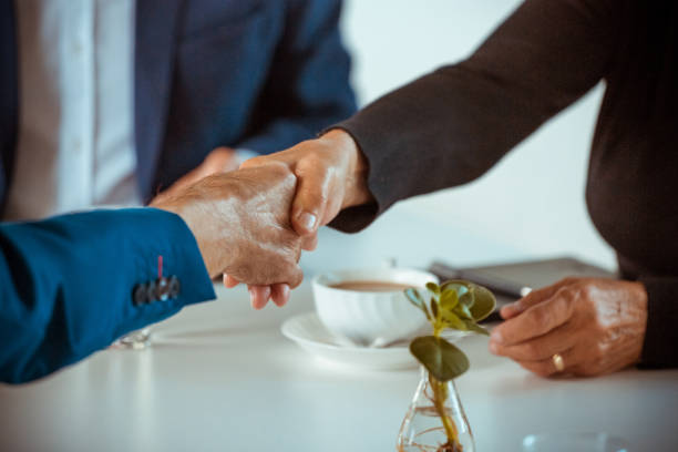 istock Senior business people shaking hands 1278955807