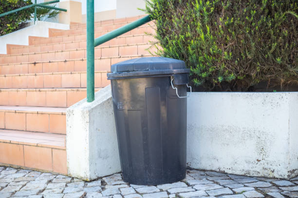 istock black plastic garden trash can in front of the stairs 1278955837