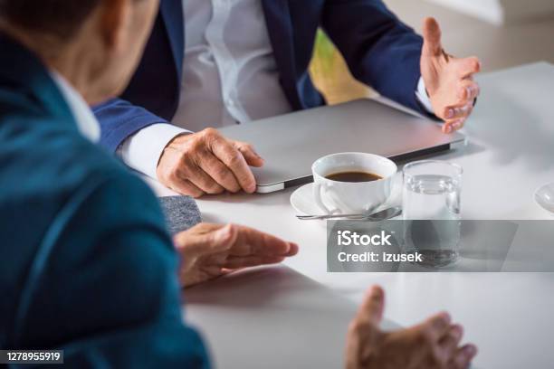 Senior Businessmen During Meeting Stock Photo - Download Image Now - Office, Business Meeting, Suit