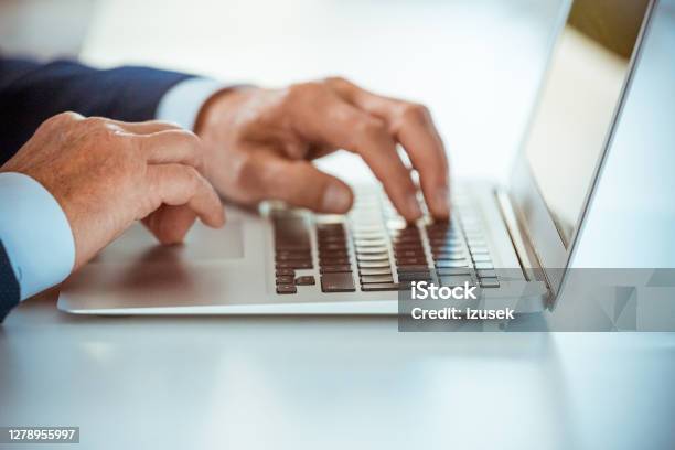 Senior Businessmen Using Laptop Stock Photo - Download Image Now - Blue, Meeting, Suit