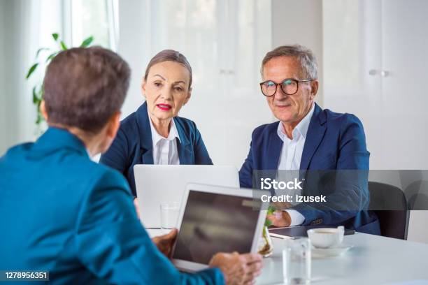Shareholder During Business Meeting Stock Photo - Download Image Now - 65-69 Years, 70-79 Years, Active Seniors