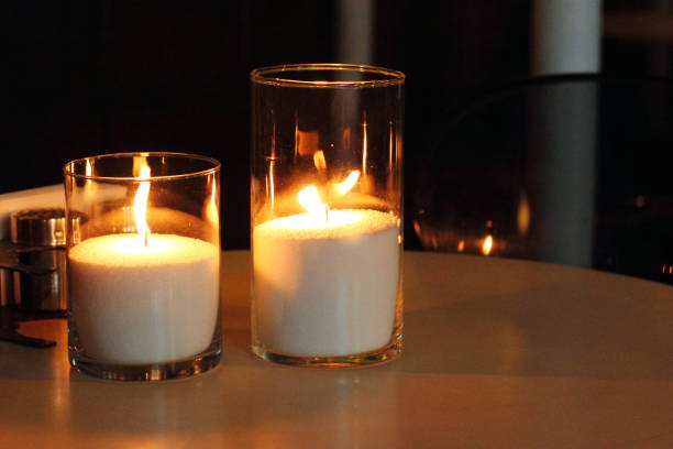istock Lighted candles in candlesticks in a cozy home environment 1278958715