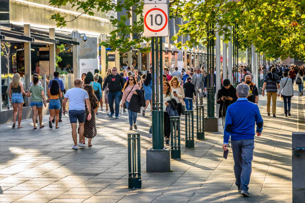 Many people are walking along the promenade at Southbank Melbourne, Victoria, Australia, February 22, 2020: Many people are walking along the promenade at Southbank next to the Yarra River speed limit sign australia stock pictures, royalty-free photos & images