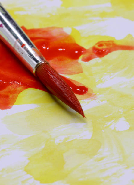 istock close-up brush and paint on colored background 1278961247