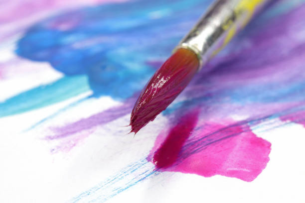 istock close-up brush and paint on colored background 1278961362