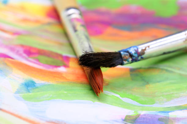 istock close-up brush and paint on colored background 1278961418