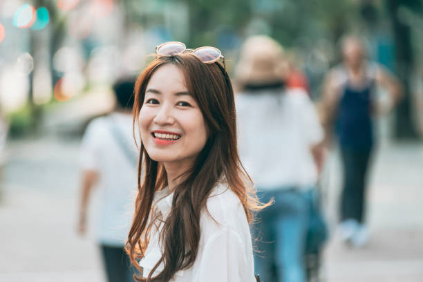 istock Asian woman smiling at the camera 1278961770