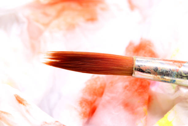 istock close-up brush and paint on colored background 1278961942