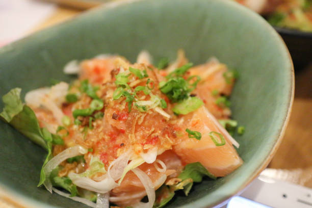 istock Salmon salad on green bowl 1278963856