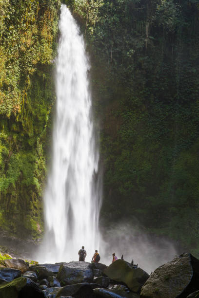 istock Pyramid of stones next to a waterfall. 1278963904