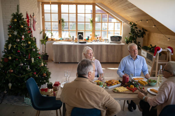 istock Senior friends having fun time during lunch at home 1278964021