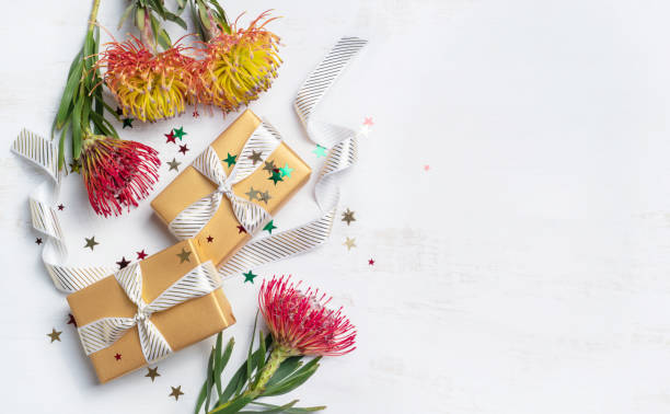 istock Gifts surrounded by Australian native Waratah flowers. 1278965274