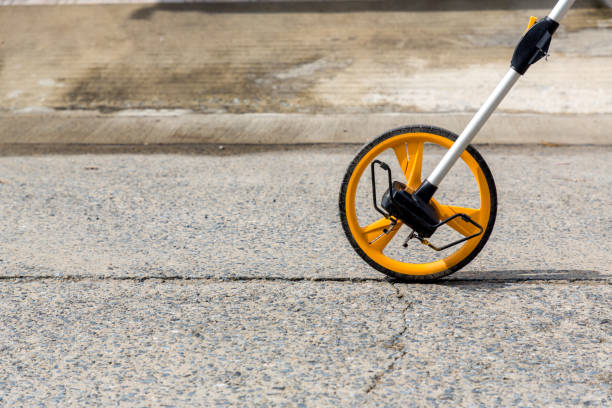 istock Distance measuring wheel device. Rolling distance measurement tool. Construction measuring tool. Measuring wheel tool for calculating distance. Outdoor surveying measurement tool with rolling odometer 1278965585