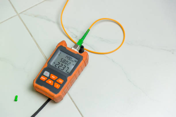 Fiber optic testing equipment.  High precision fiber optic cleaver is being used during a fiber optic wire install at House.