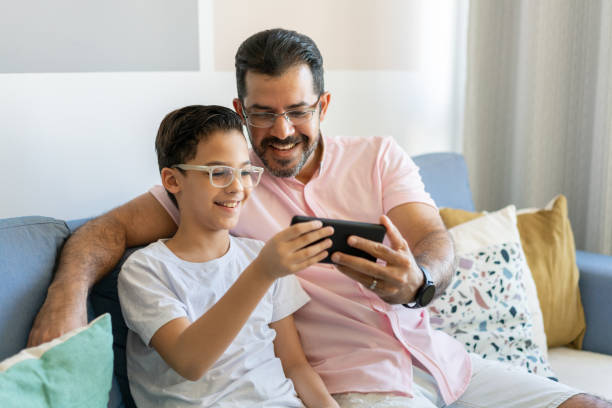 istock Father and son on video call at home 1278967479