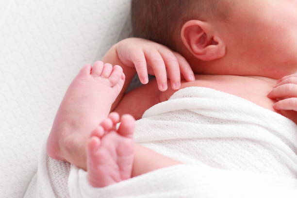 istock Small tender feet of a newborn 1278968658
