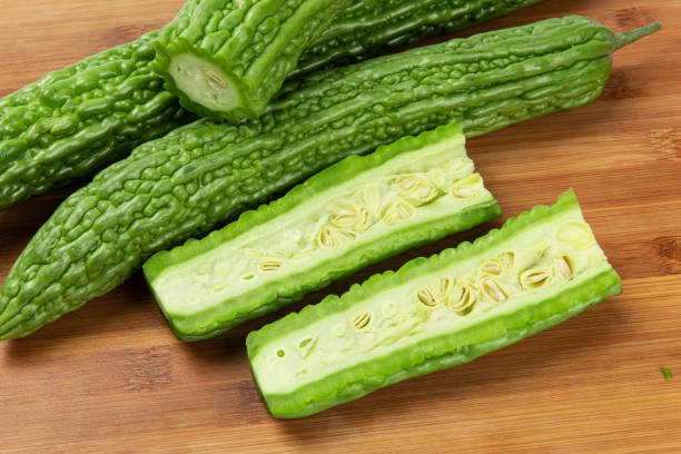 slices of bitter gourd arranged on chopping board
