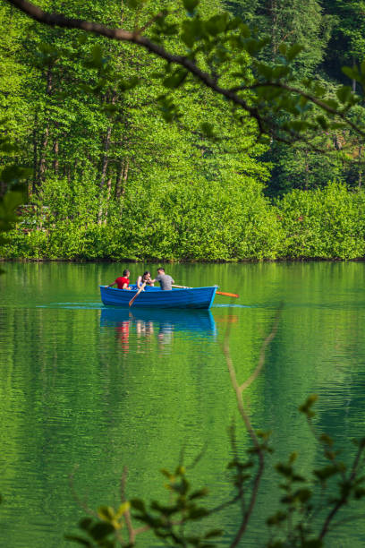 Artvin, Borcka/Turkey- June 05, 2019: Unidentified people rowing in a boat in Savsat Karagol Nature Park in Blacksea region.