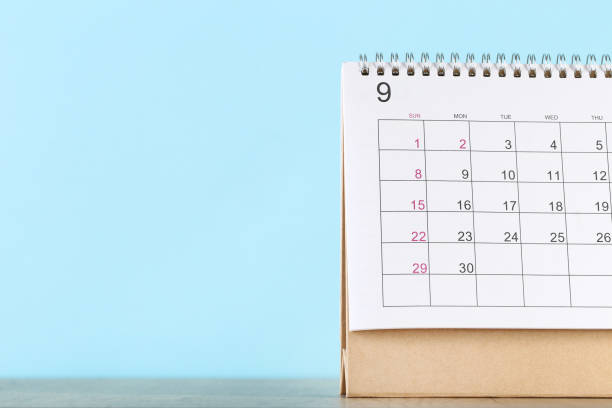 istock Paper calendar page on blue background 1278971169