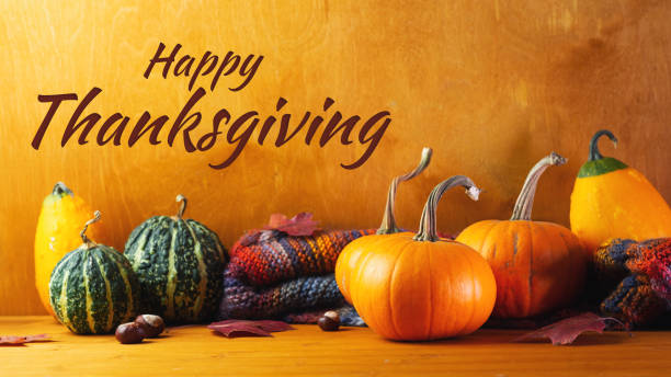 istock Happy thanksgiving. Autumn different pumpkins, maple leaves , knitted scarf on a wooden rustic table 1278972731