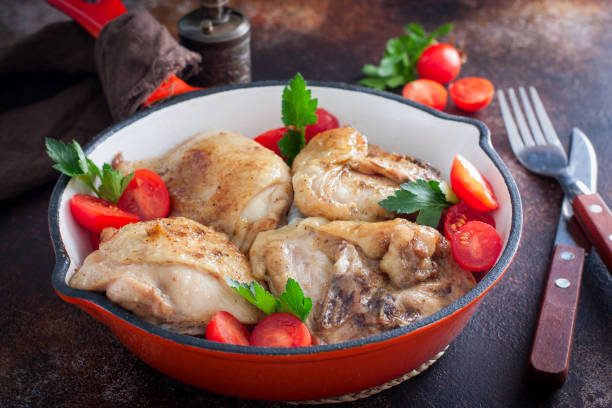 istock Fried chicken thighs in a portioned cast iron pan, selective focus 1278973333