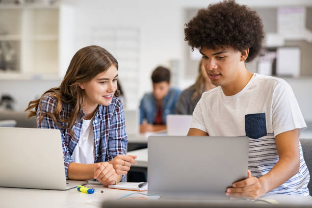 istock Multiethnic students studying together on laptop 1278975519