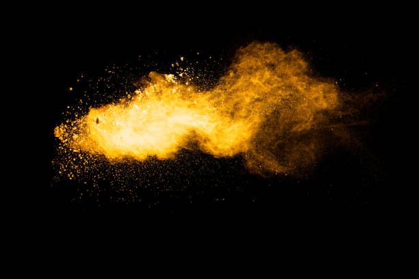 istock Orange color powder explosion on black background. 1278977149
