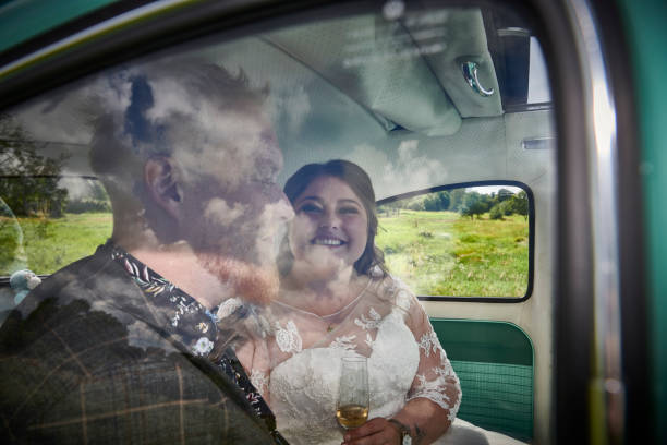Wedding couple sitting in car