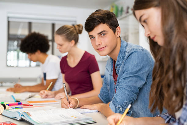 istock Guy studying with friends at college 1278977919