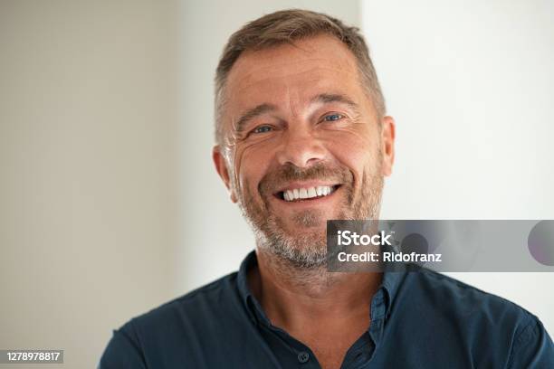 Portrait Of Happy Mature Man Smiling Stock Photo - Download Image Now - Men, Smiling, Portrait