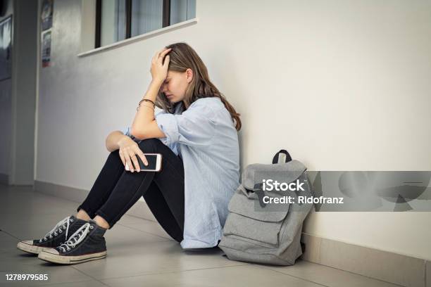 Cyber Bullying At High School Stock Photo - Download Image Now - Teenager, Sadness, Depression - Sadness