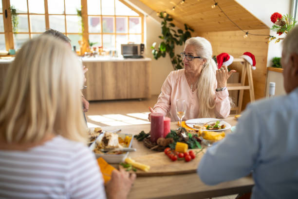 istock Senior couples having lunch on double date at home 1278979601