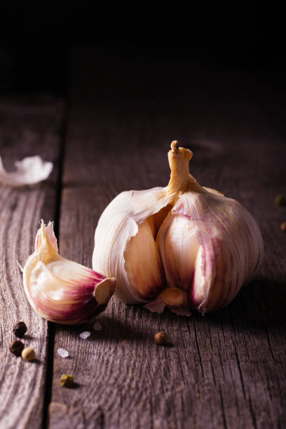 istock Garlic on a wooden table 1278980068