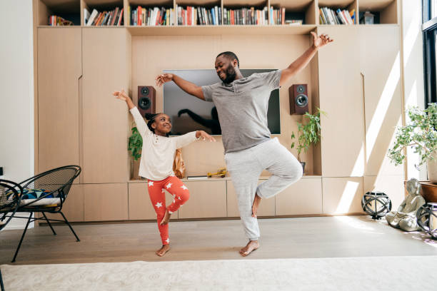 istock Contagious dance- dad and daughter dancing together 1278981584