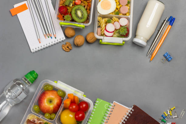 istock Three lunchboxes with nuts, fruits, vegetables, bacon. 1278982638