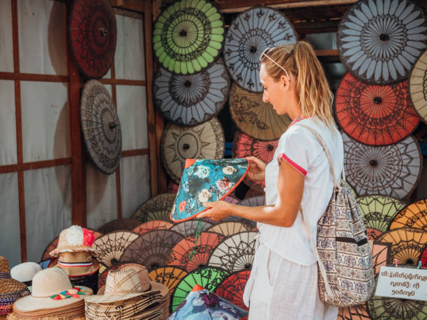Woman shopping hand crafted products in local market in Bagan