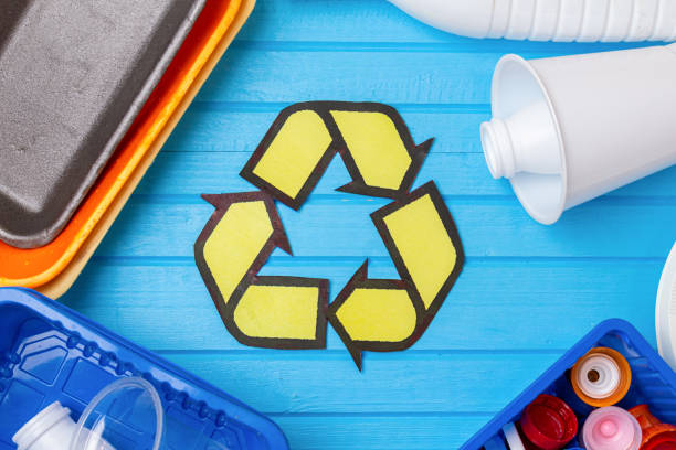 istock color plastic waste with recycling on blue background. Eco concept with copy space 1278984649