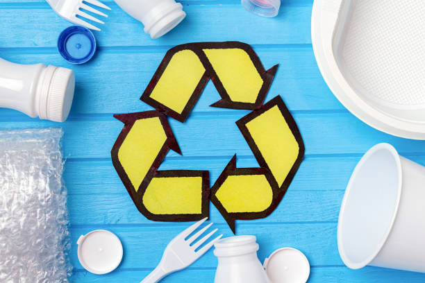 istock white plastic waste with recycling on blue background. Eco concept with copy space 1278984732